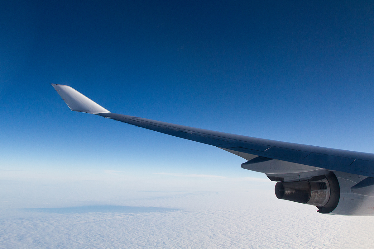 beautiful shot from airplane window wings clouds