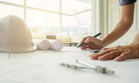 hands engineer working blueprint construction concept engineering tools vintage tone retro filter effect soft focus selective focus