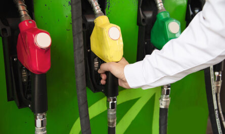 man putting gasoline fuel into his car pump gas station 1