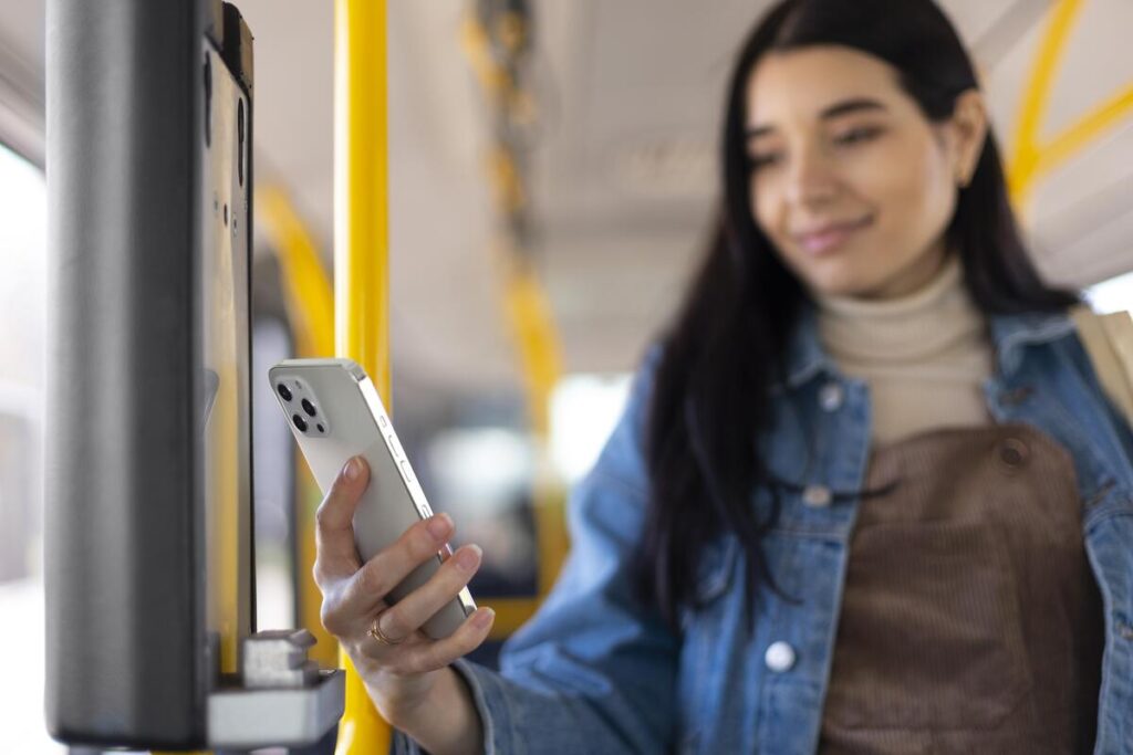 medium shot woman holding phone 1