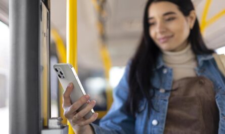 medium shot woman holding phone 1