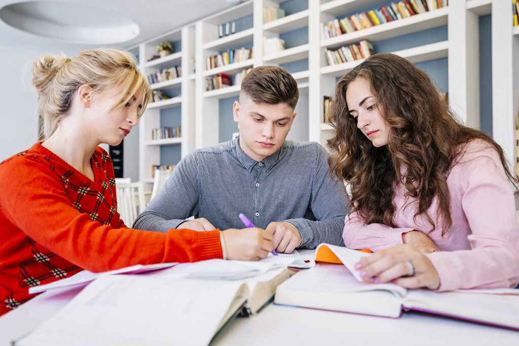 students studying together library
