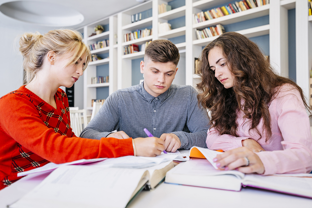 students studying together library