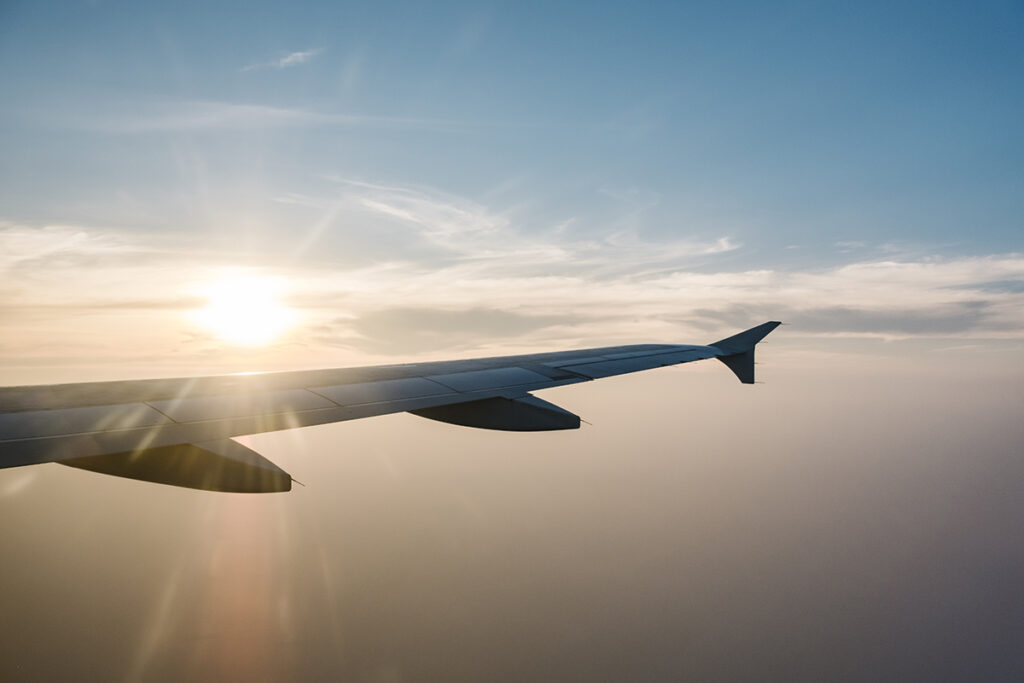 airplane wing sunset blue sky