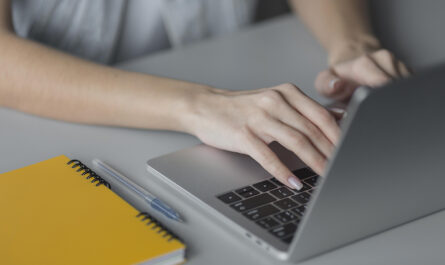 close up hands typing keyboard
