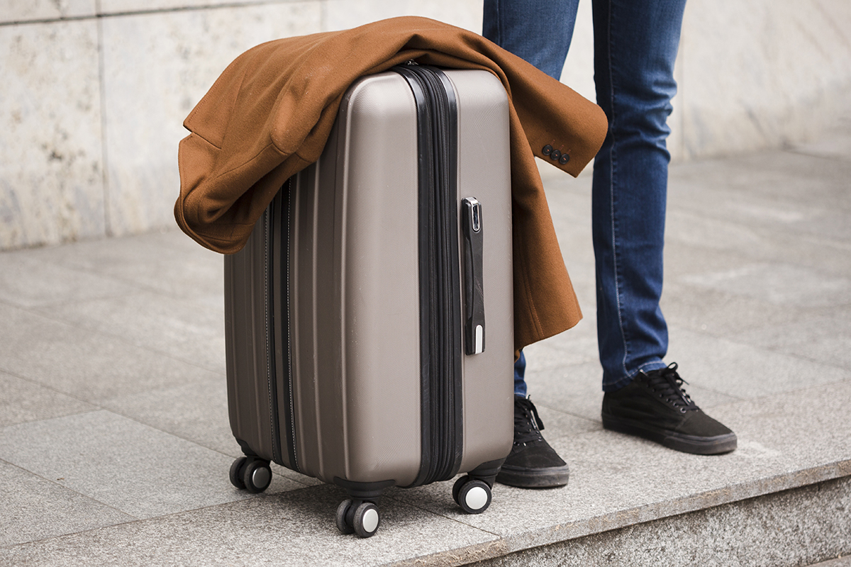 close up traveler with luggage