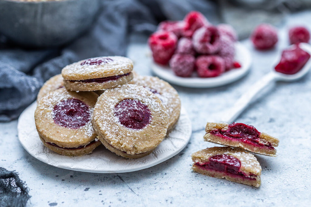 closeup shot delicious homemade cookies with frozen raspberries