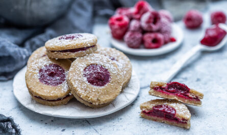closeup shot delicious homemade cookies with frozen raspberries