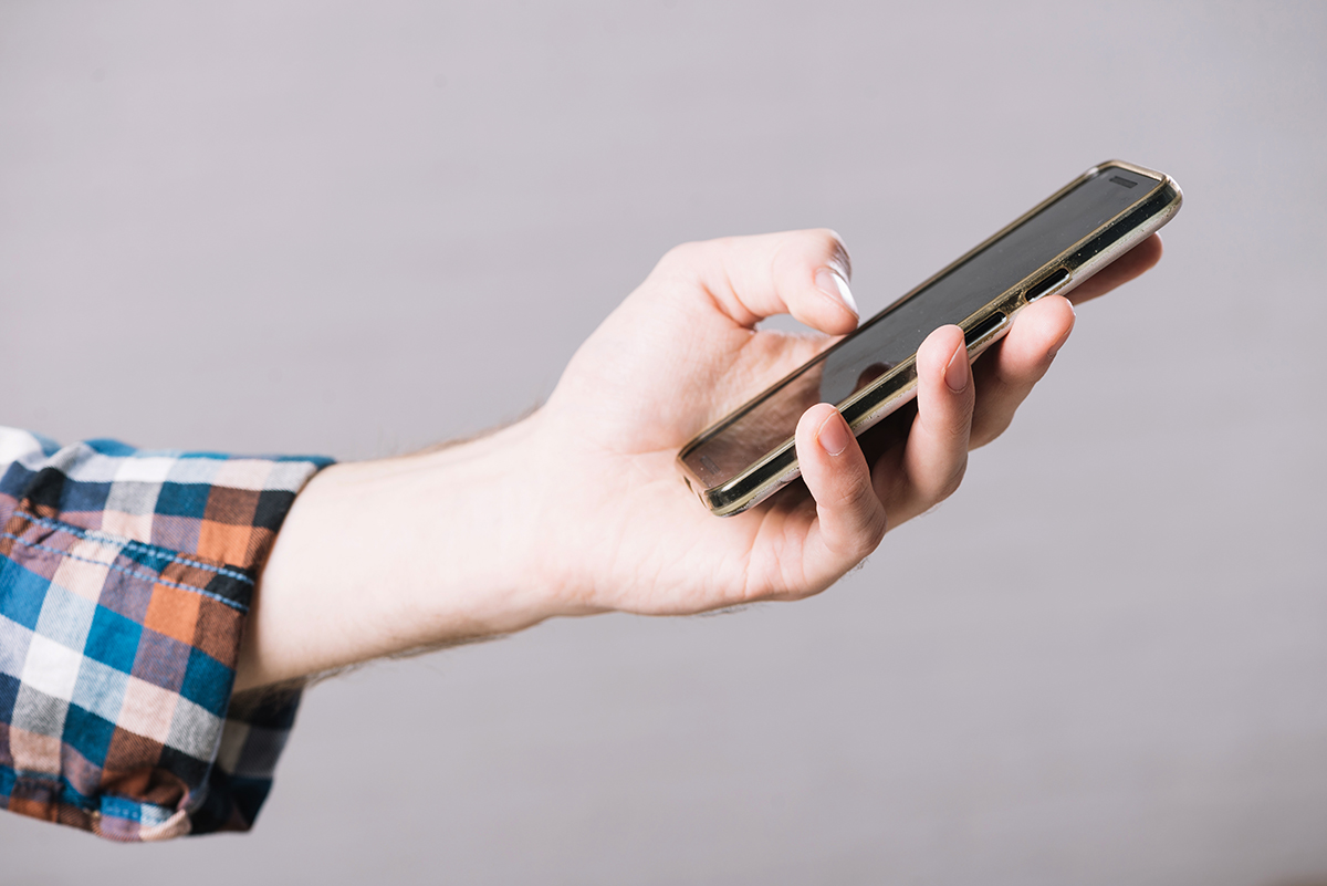 crop hand man with smartphone