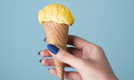 hand holding delicious ice cream cone