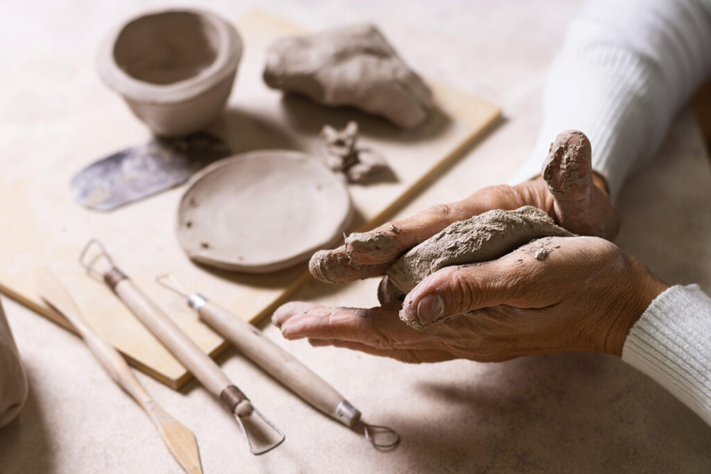 mixing clay pottery pot