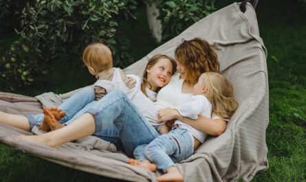 mother with children having fun hammock mom kids hammock