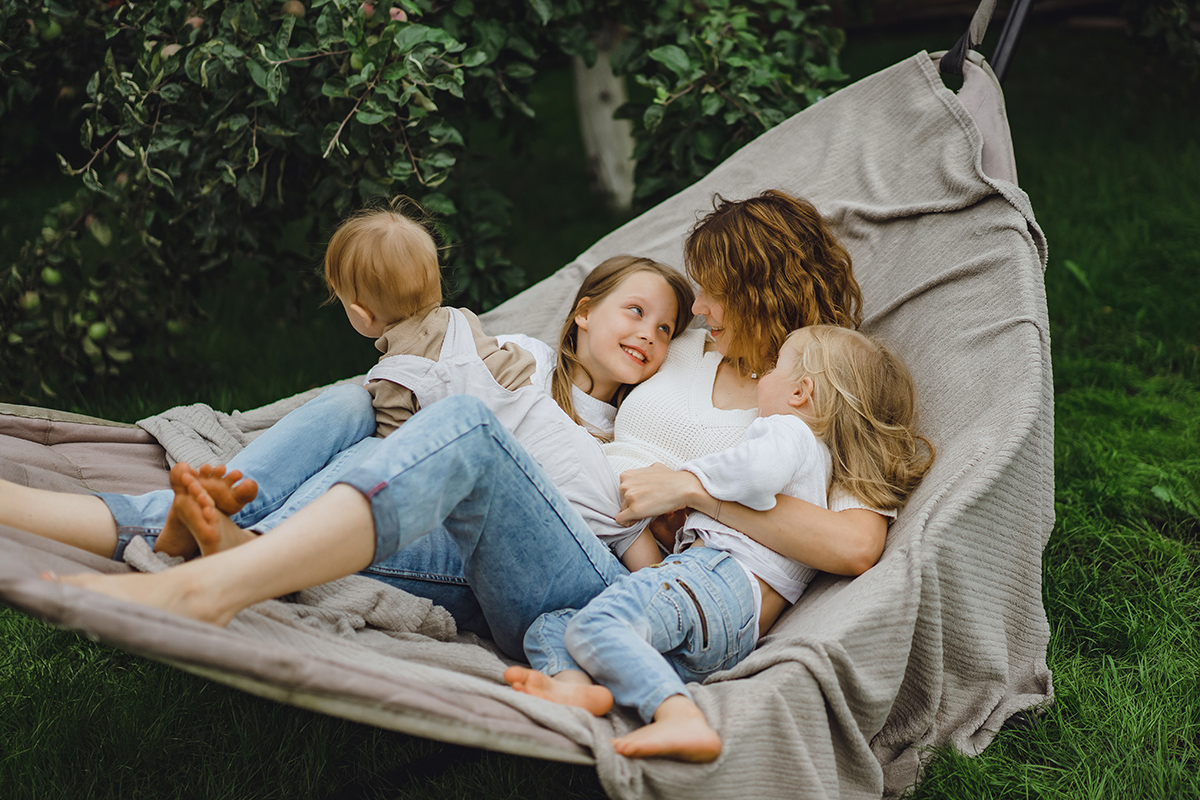 mother with children having fun hammock mom kids hammock