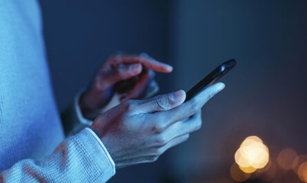 side view man using smartphone
