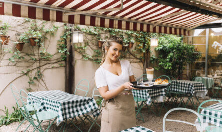 smiling waitress holding tray 1