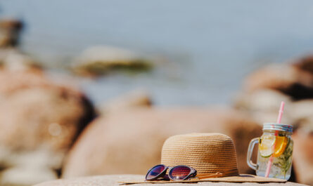 beutiful beach landscape with sunglasses hat