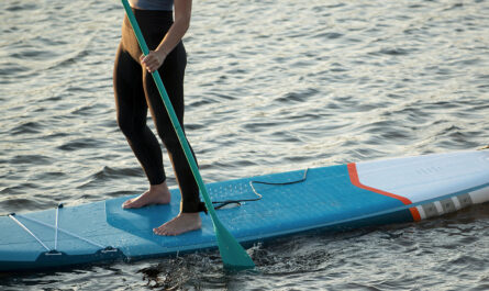 close up woman paddleboarding