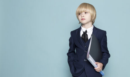 front view cute business boy blue classic suit holding black folder business work fashion