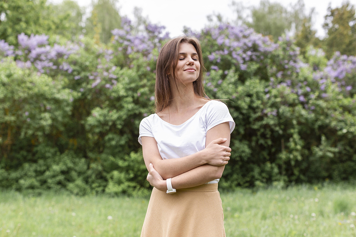 low angle woman with arms crossed