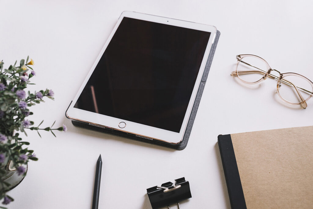 tablet glasses near stationery