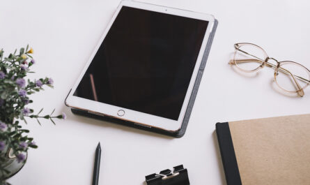 tablet glasses near stationery