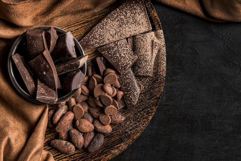 top view dark arrangement with chocolate with copy space