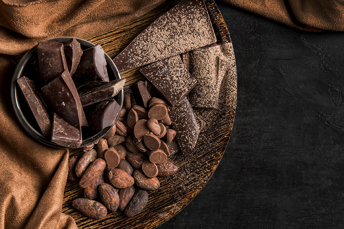 top view dark arrangement with chocolate with copy space