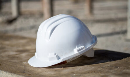 white construction helmet ground sunlight