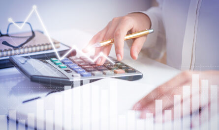 accountant calculating profit with financial analysis graphs