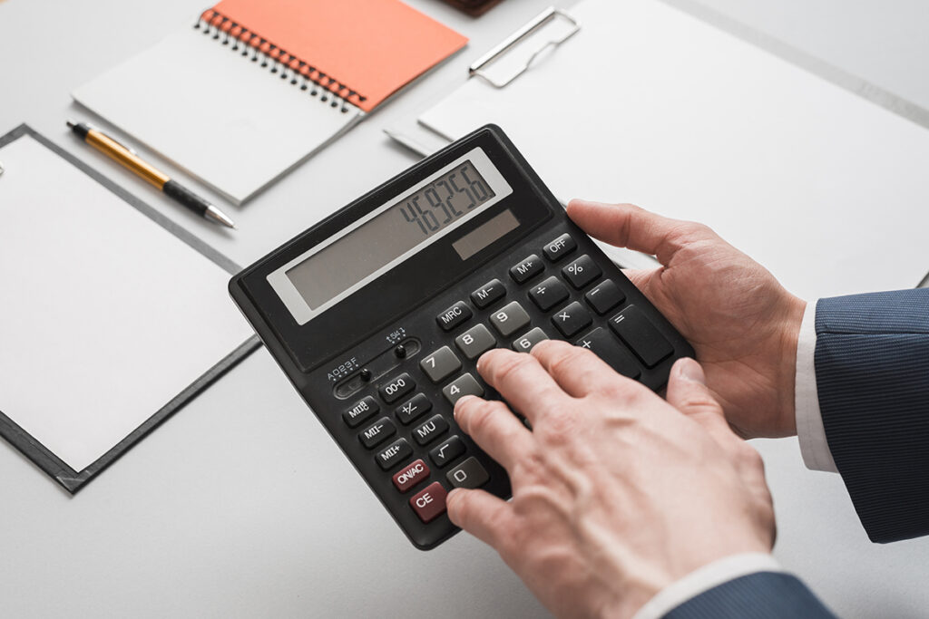 business concept with hands using calculator 1