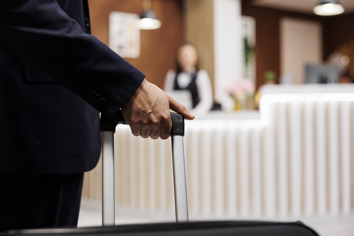 businessman arriving hotel lobby