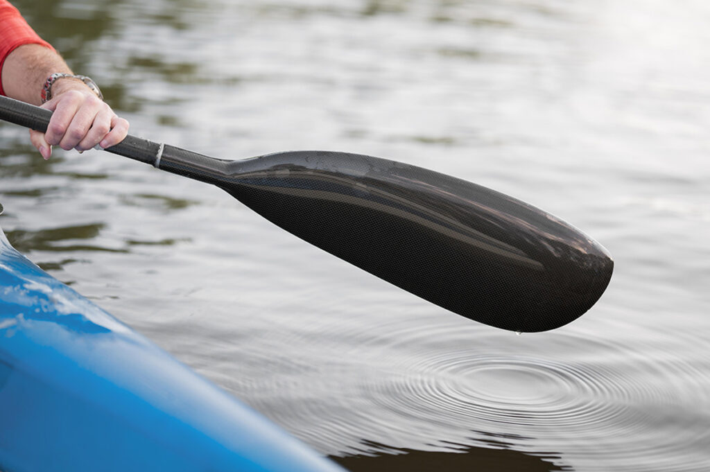 close up hand holding oar