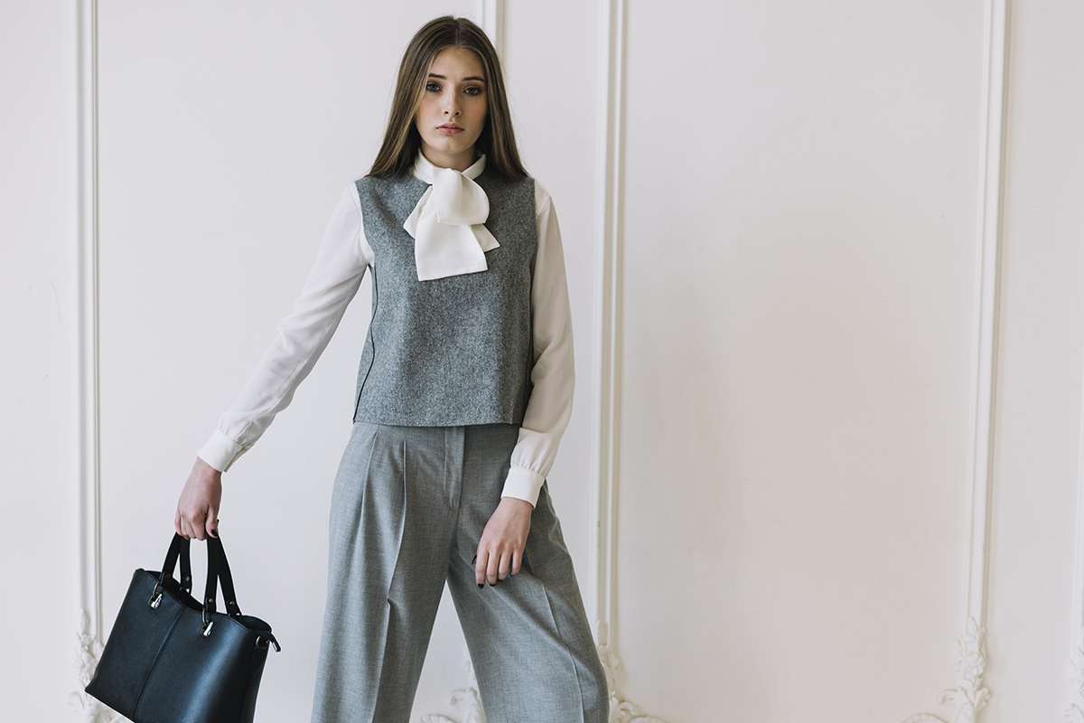 elegant young woman costume with handbag room