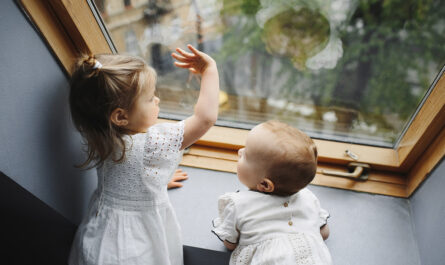 little children look out window