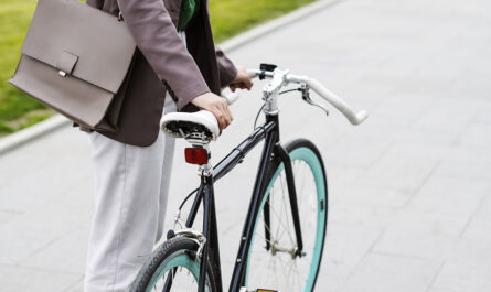 young adult cycling work city