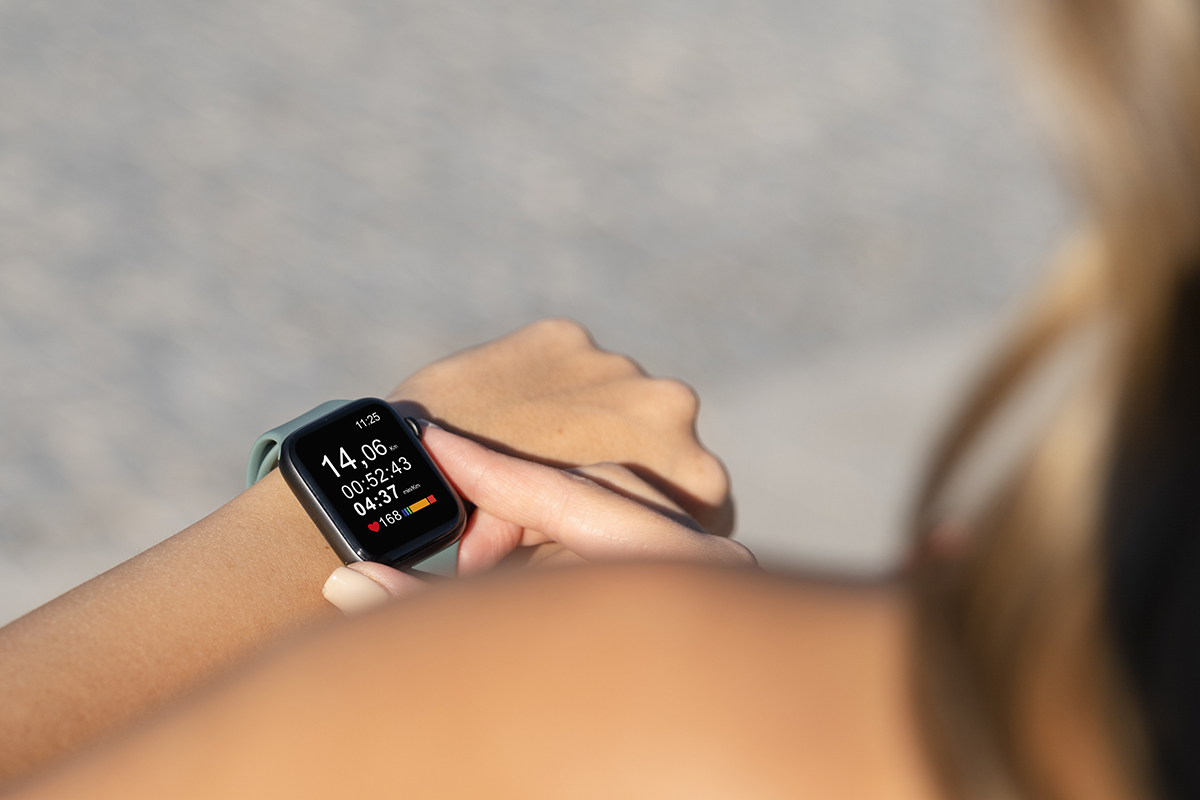 close up hand wearing smartwatch