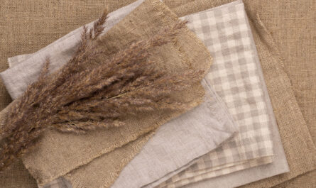 flat lay monochromatic selection textiles with dried grass