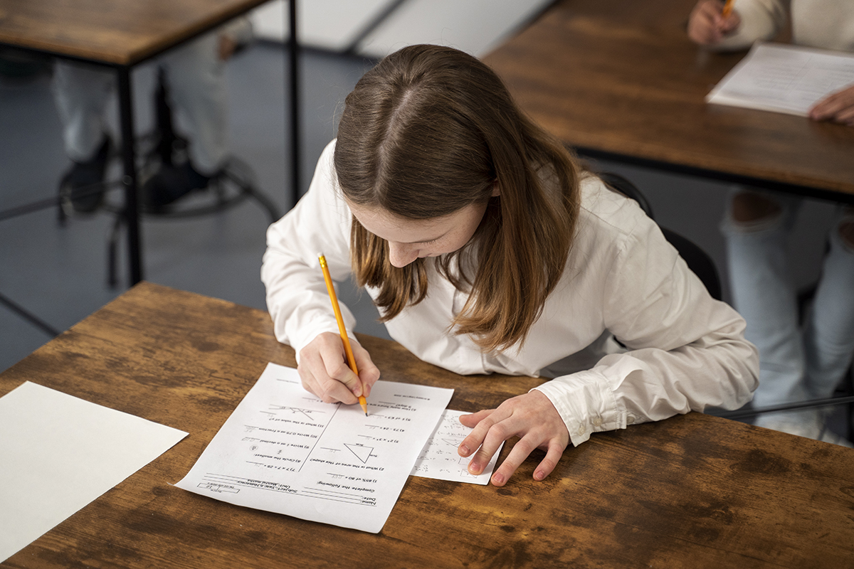 medium shot kid cheating school test