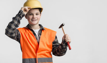portrait young boy dressed up as construction worker