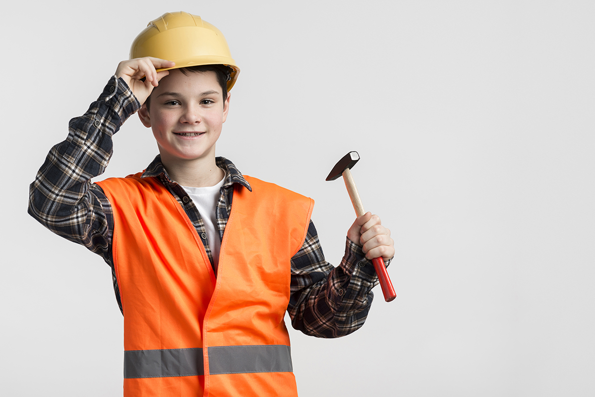 portrait young boy dressed up as construction worker