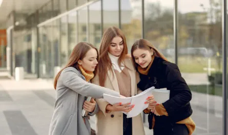 young students student campus standing with documents