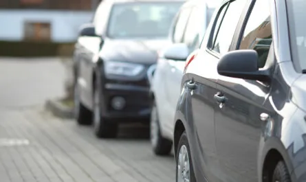 closeup shot black car parking lot with blurred background