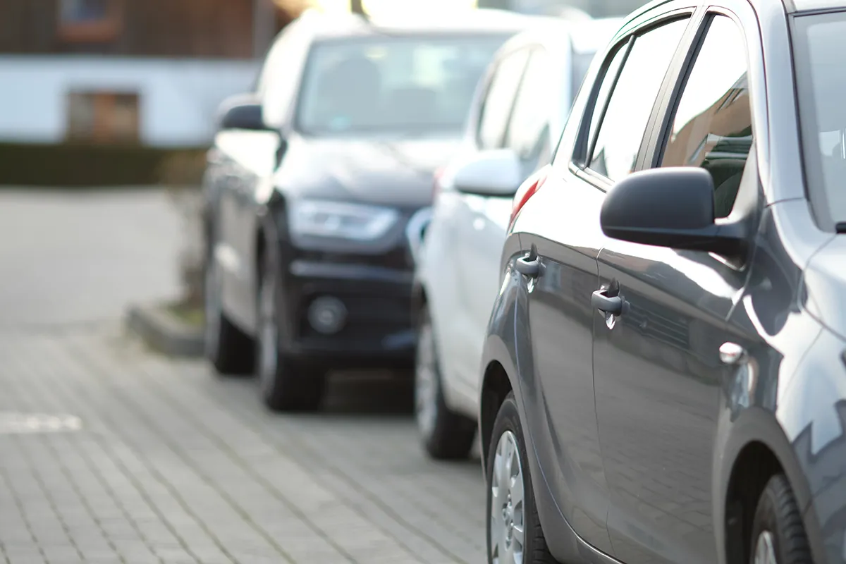 closeup shot black car parking lot with blurred background