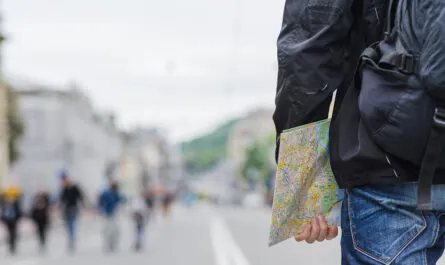crop man with map city street