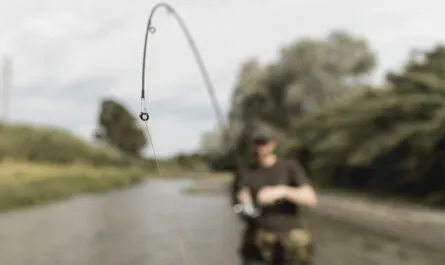 man fishing river