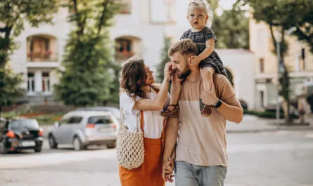 parents with their little daughter town