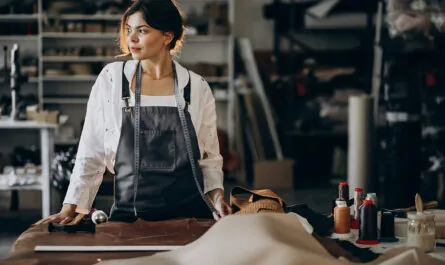 woman tailor working leather fabric