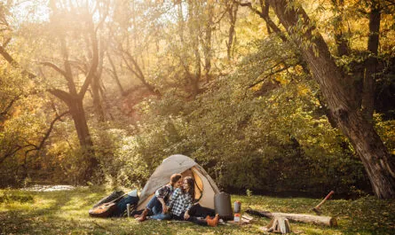 young loving couple camping forest