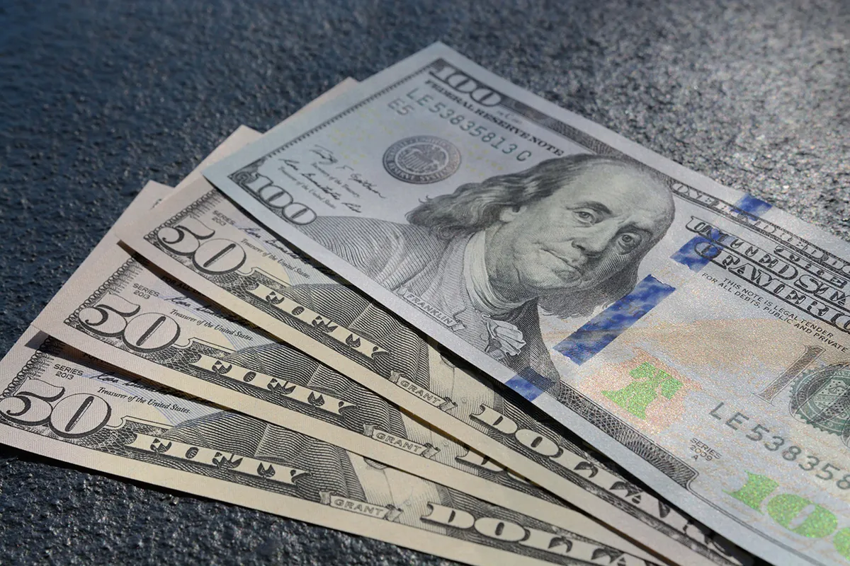 closeup shot three fifty one hundred dollars bills
