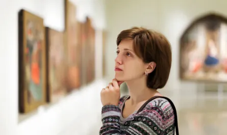 visitor looking pictures art gallery
